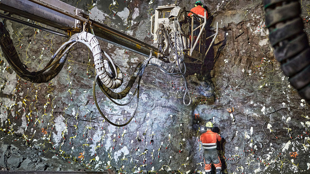 Tunneling. Rig and tunnel workers blow up rocks. Photo.